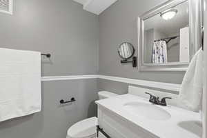 Bathroom with vanity and a shower with curtain