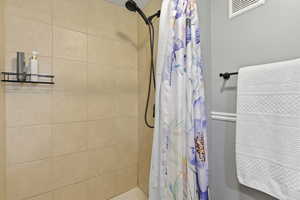 Bathroom featuring a shower stall