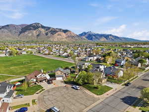 Aerial view of residential area featuring a mountainous background