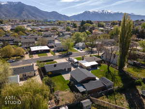 Aerial view of residential area featuring a mountainous background