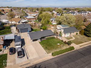 Aerial perspective of suburban area featuring a mountainous background