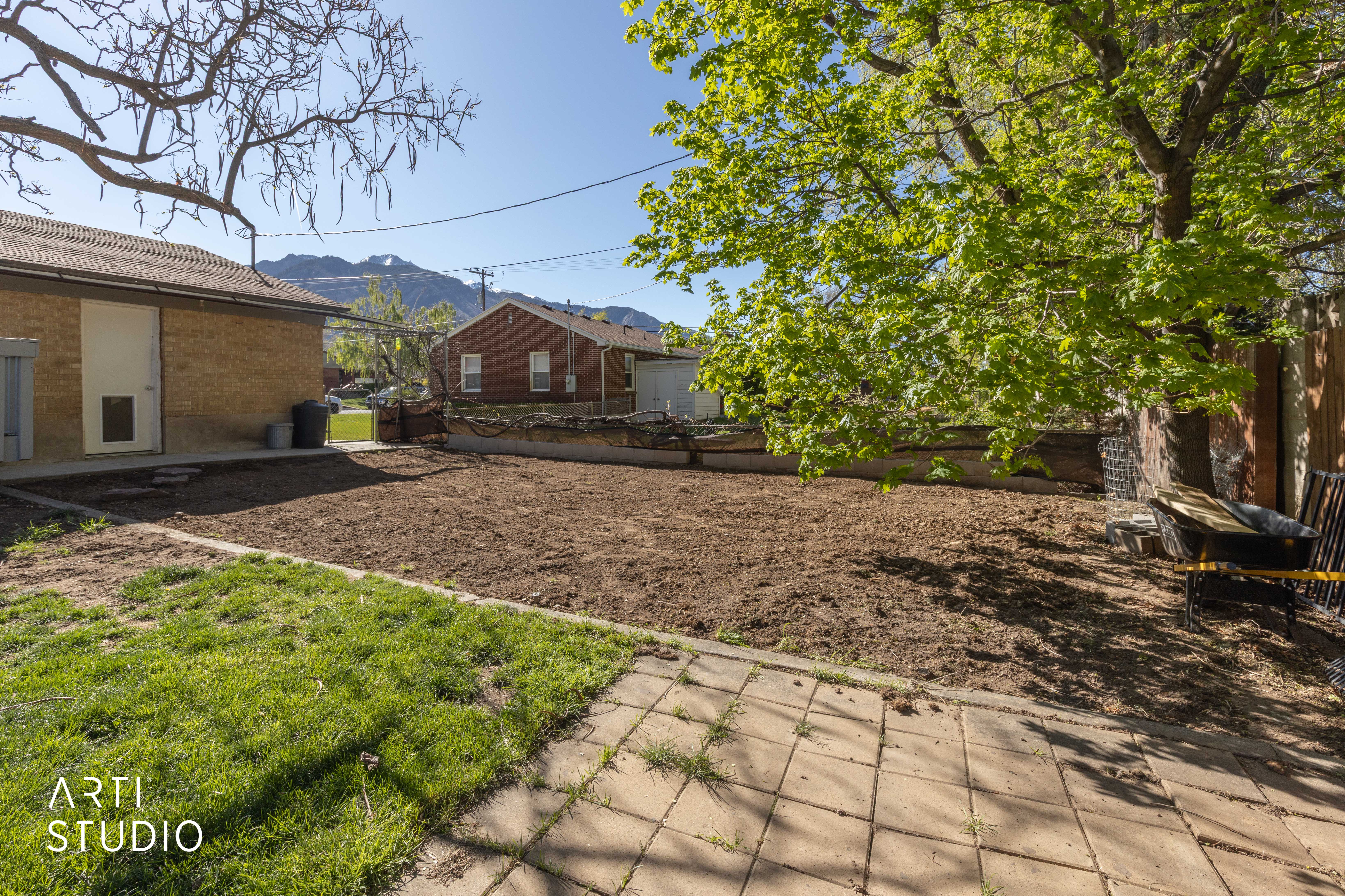 Fenced backyard with a patio area