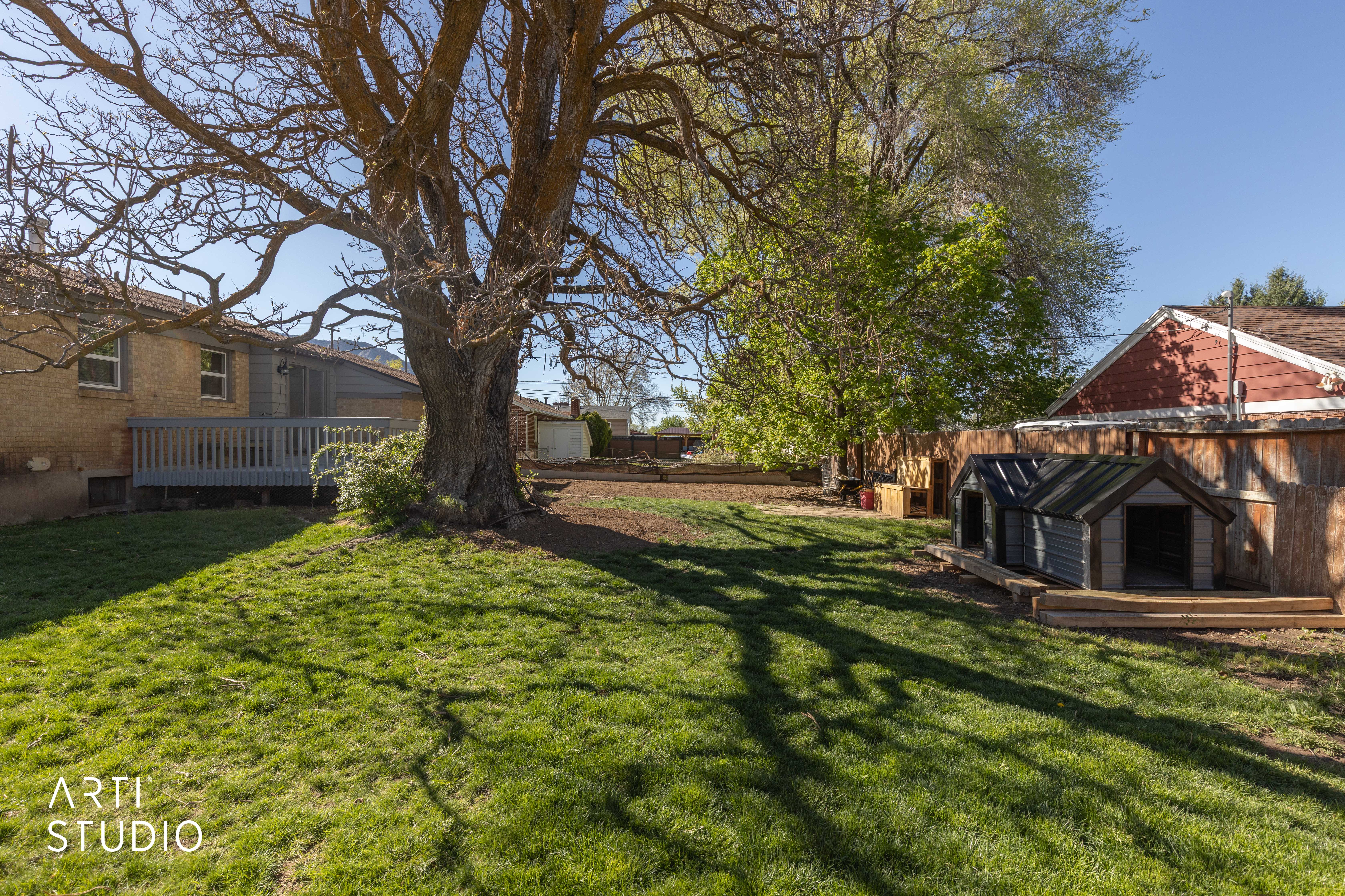 Fenced yard with a deck