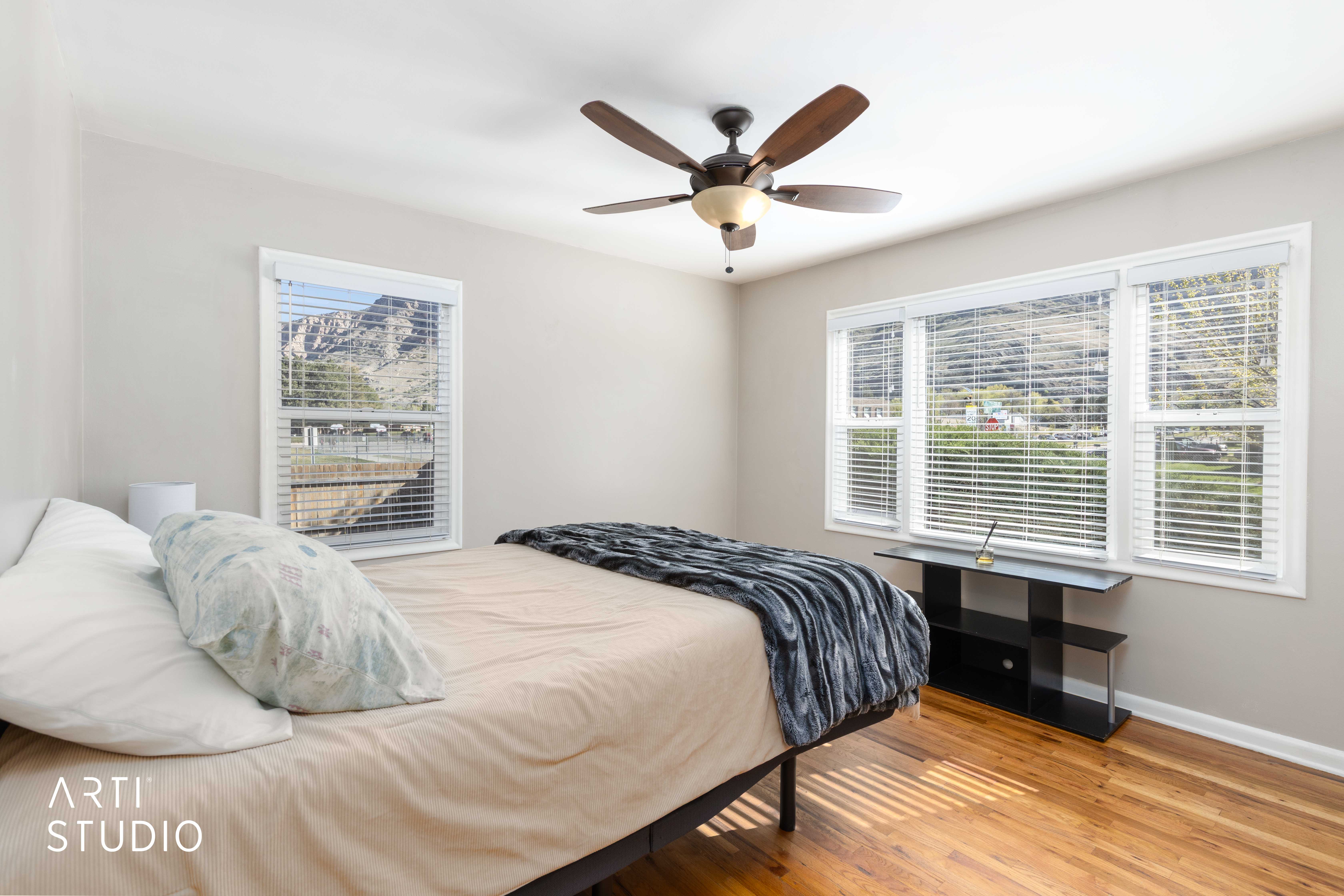 Bedroom featuring hard wood flooring and ceiling fan