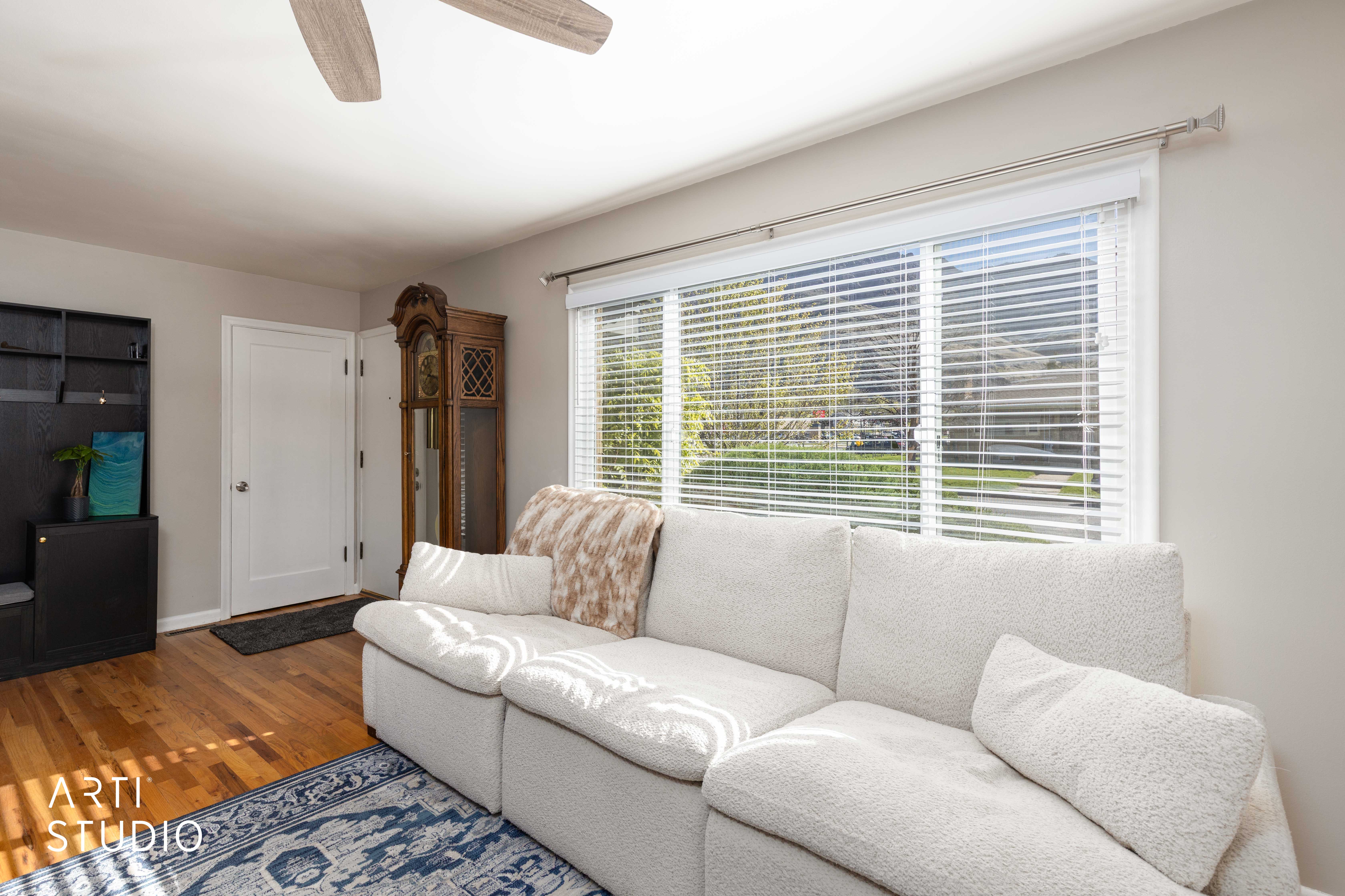 Living area featuring hardwood floors and morning window light