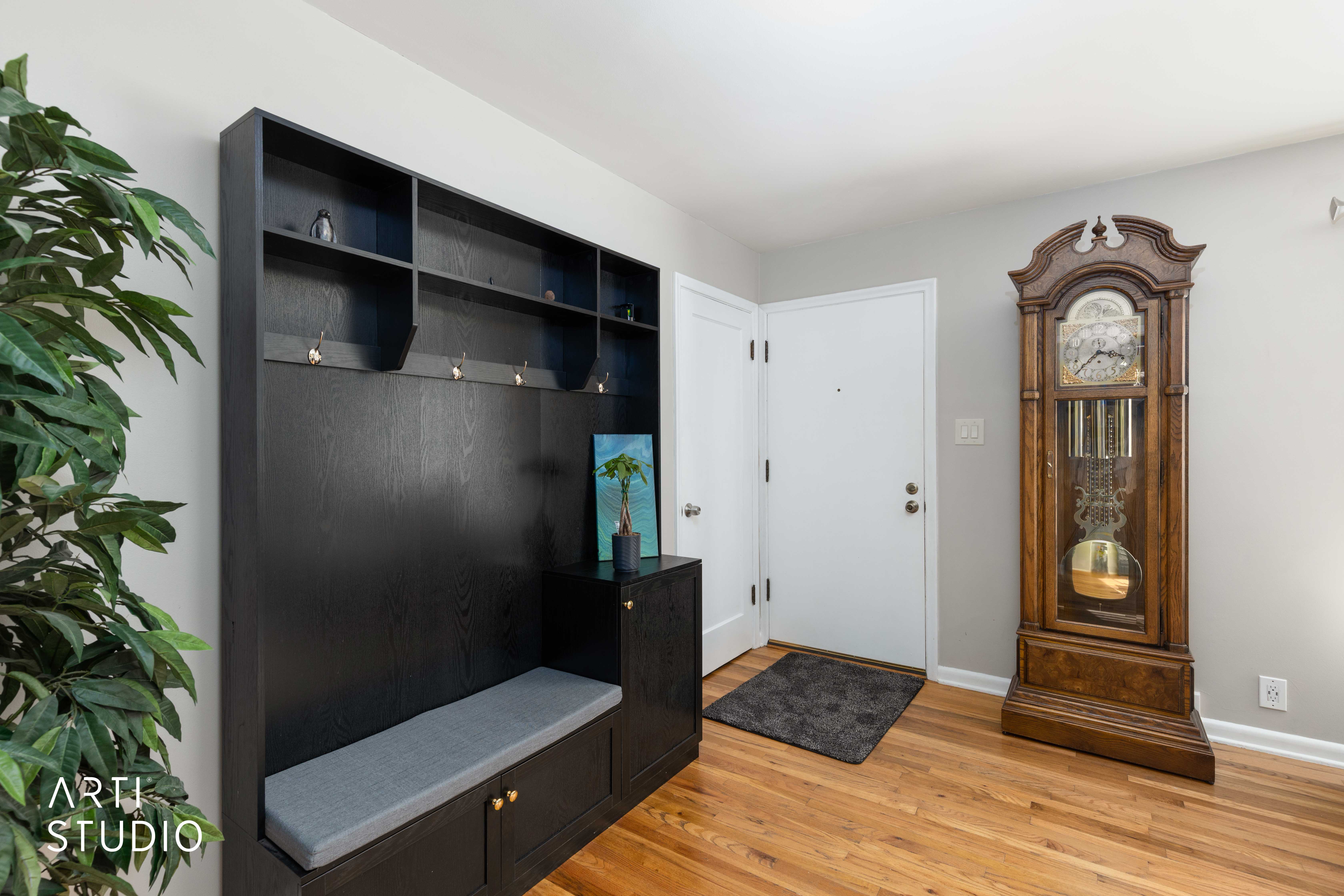 Mudroom featuring light wood-style floors and baseboards