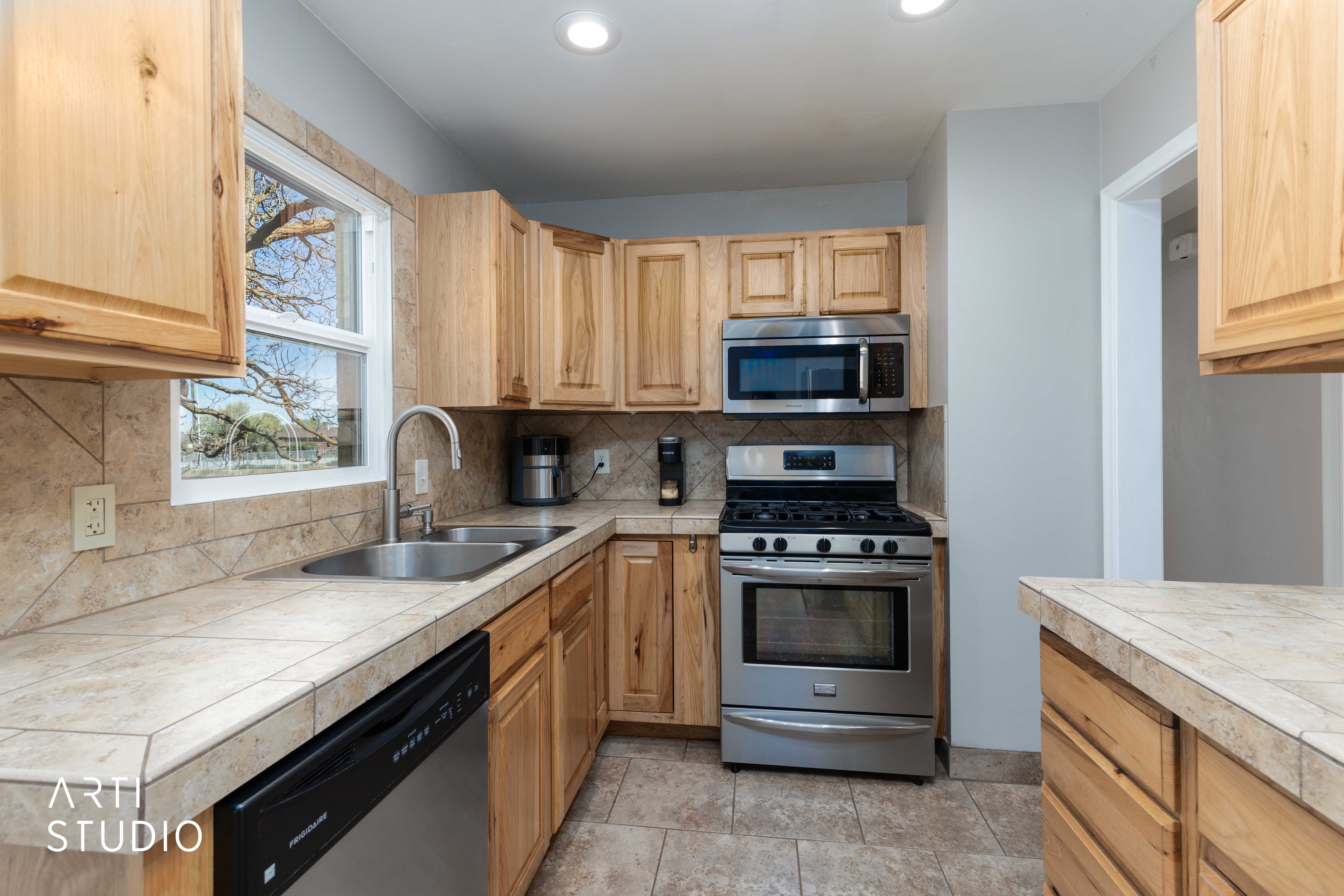 Kitchen featuring stainless steel appliances, and backsplash