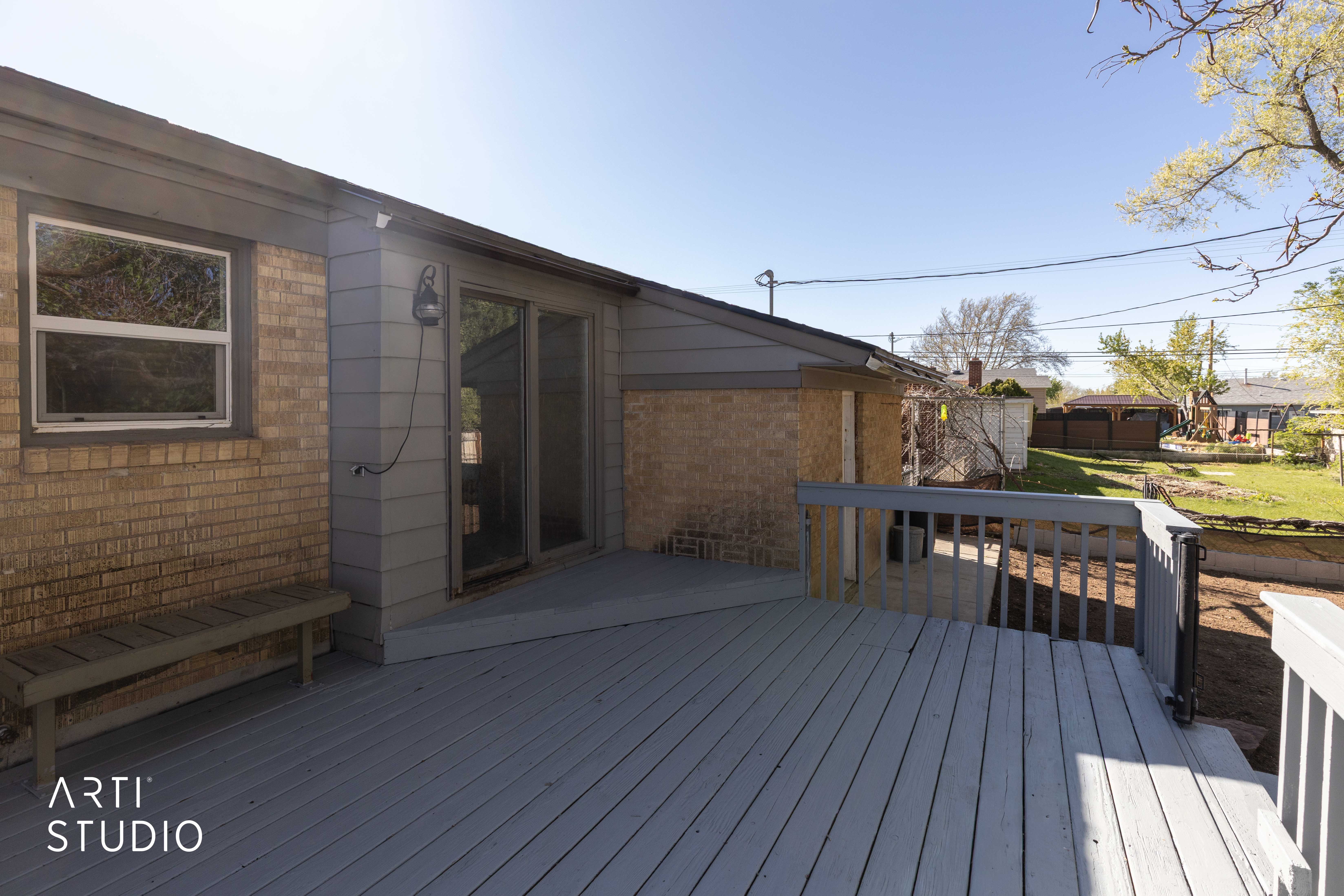 Wooden deck on west side of home