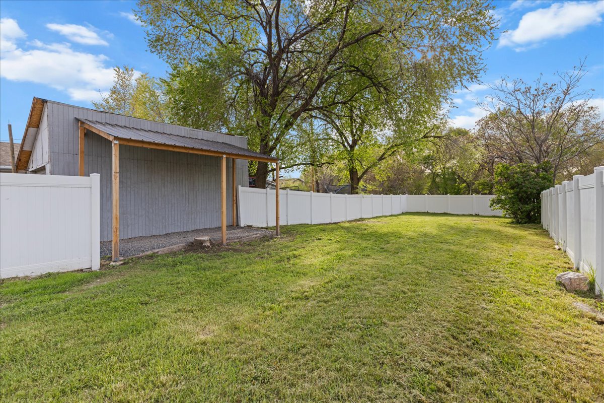 View of fenced backyard