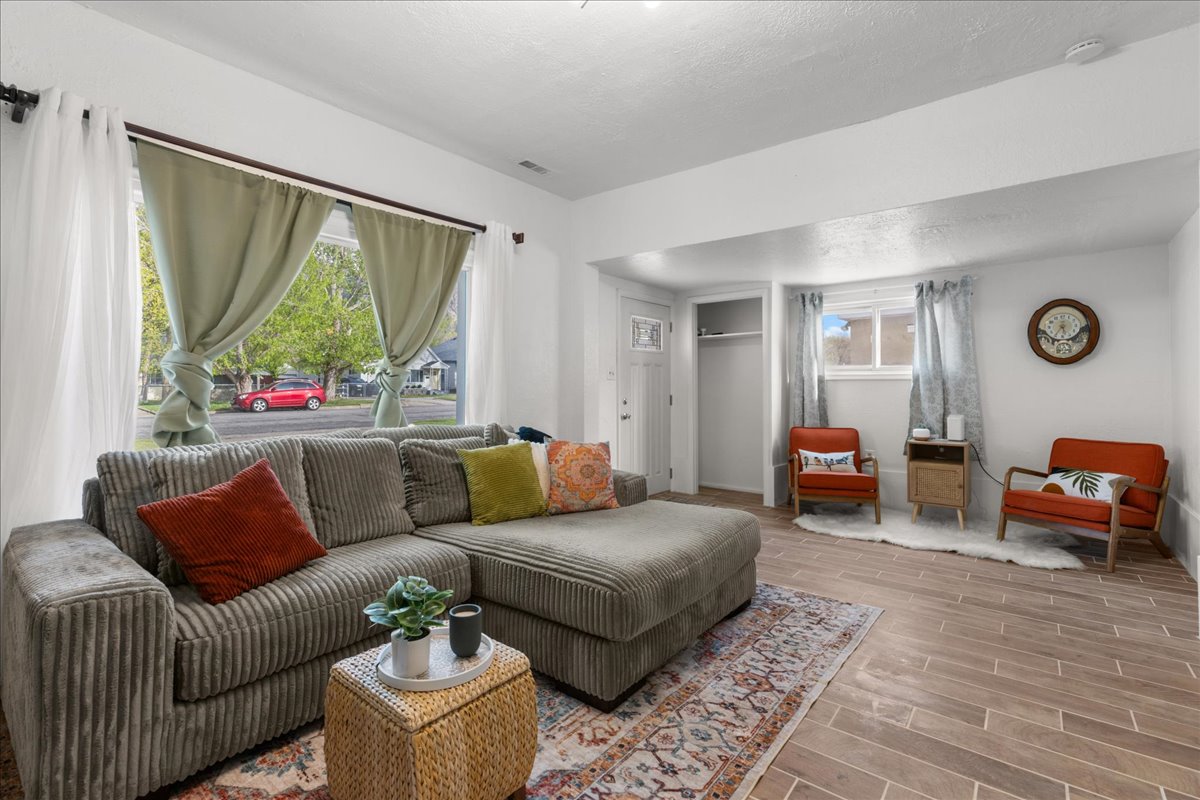 Living room featuring wood finish floors and a textured ceiling