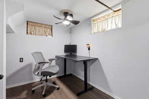 Office featuring dark wood-style flooring and ceiling fan