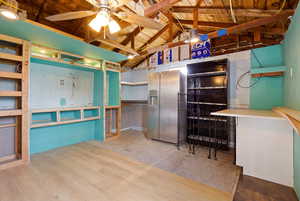 Miscellaneous room with ceiling fan and light wood-type flooring