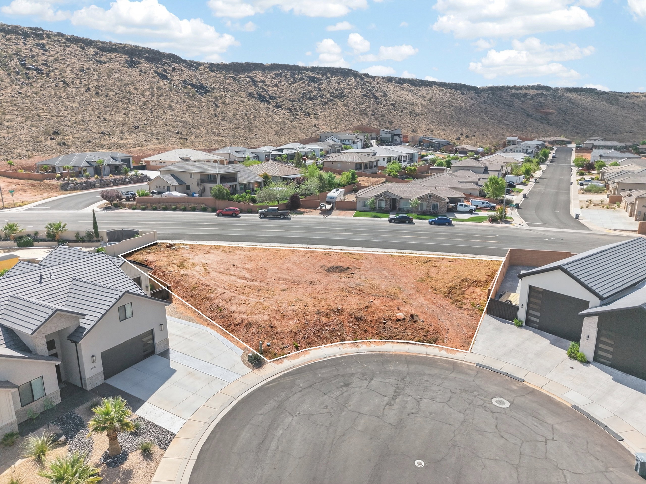 Aerial view of residential area featuring a mountain backdrop