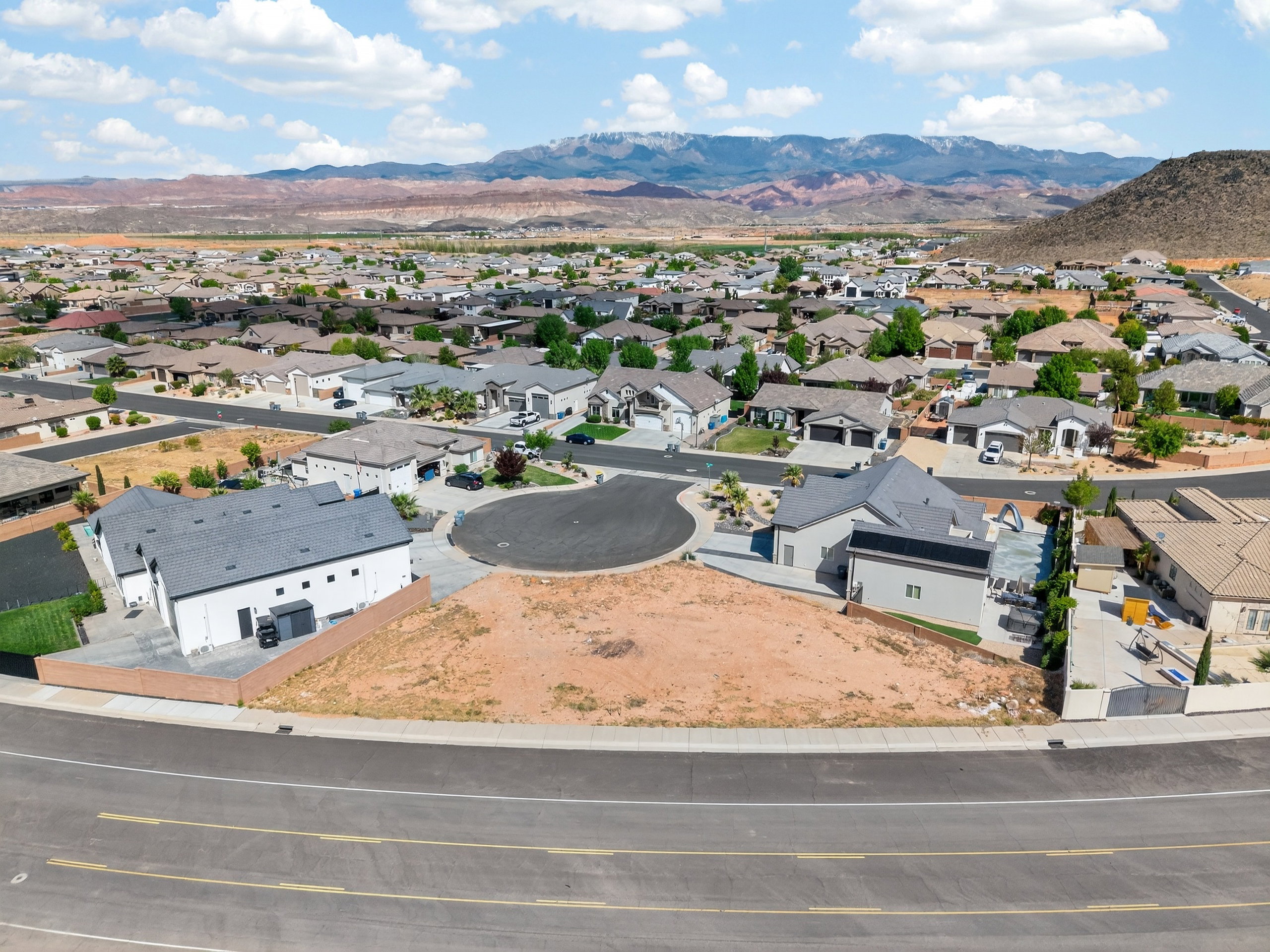 Aerial perspective of suburban area with a mountain backdrop