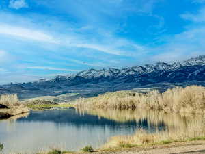 View of mountain backdrop with a nearby body of water