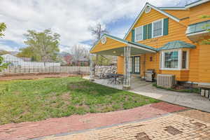 Rear view of property featuring french doors