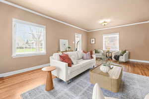Living area featuring wood finished floors and ornamental molding