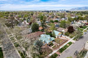 Aerial perspective of suburban area featuring a mountainous background