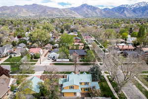Aerial perspective of suburban area featuring a mountain backdrop