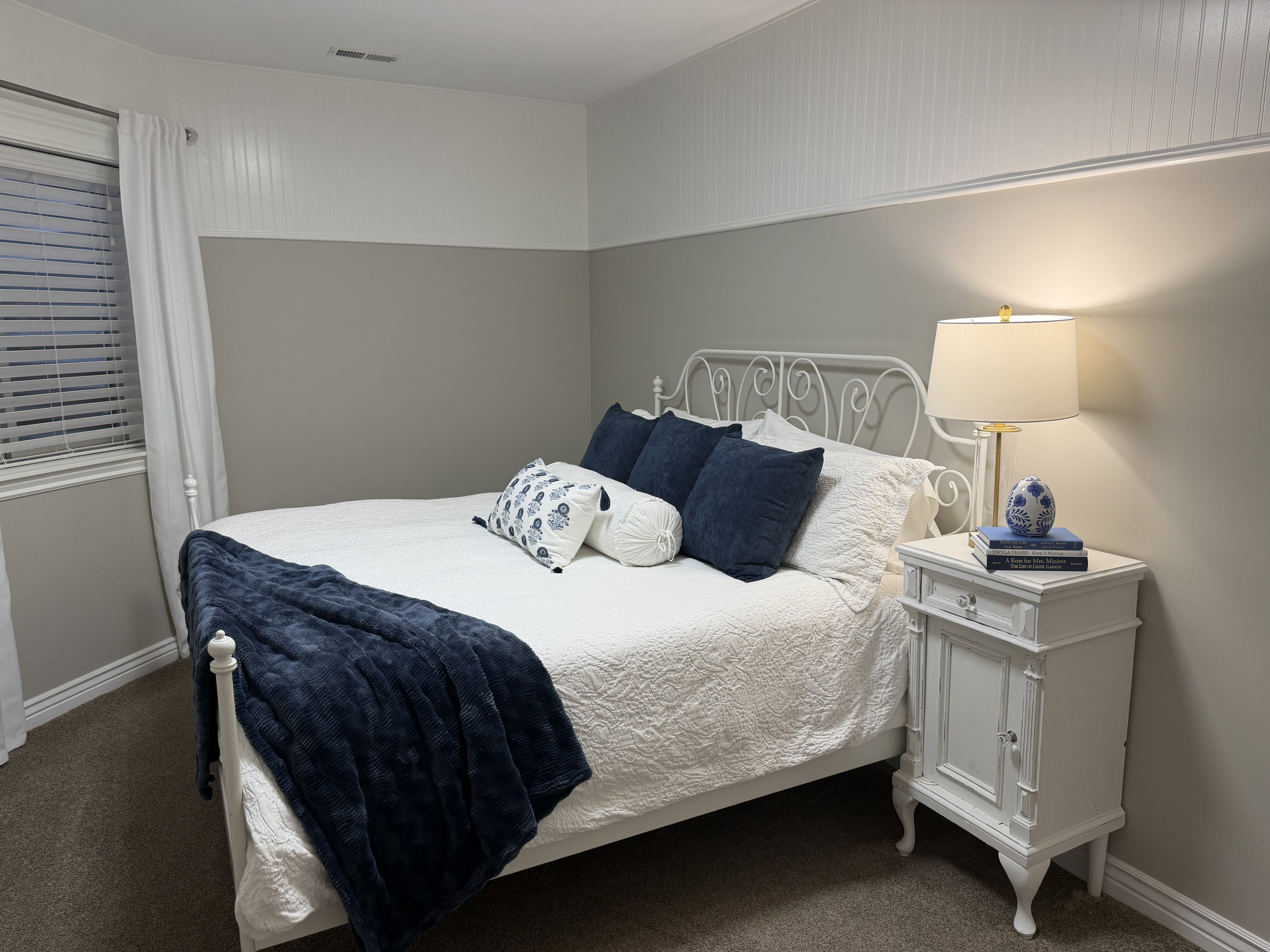 Carpeted bedroom featuring baseboards