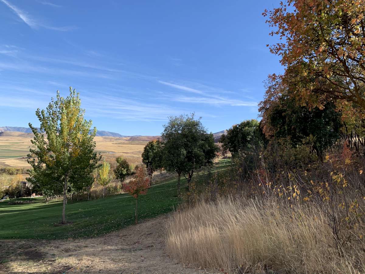 View of mountain background featuring rural landscape