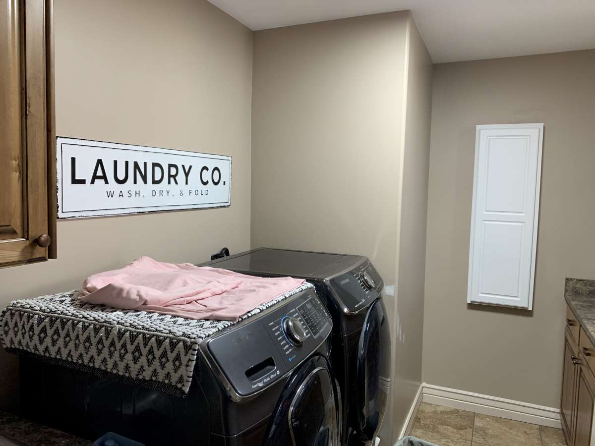 Laundry room with cabinet space and independent washer and dryer