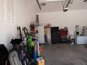 Garage with a central vacuum unit and a garage door opener