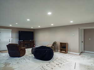 Living room with recessed lighting and baseboards