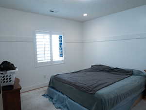 Bedroom with baseboards and recessed lighting