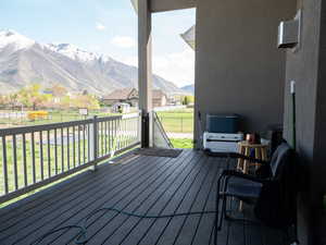 Wooden terrace with a mountain view and a residential view