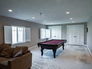 Rec room with billiards, healthy amount of natural light, unfinished concrete flooring, and recessed lighting
