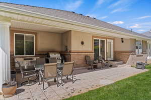View of patio with an outdoor kitchen / dining area
