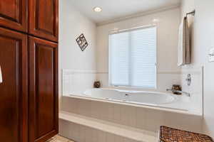 Bathroom with a bath and recessed lighting