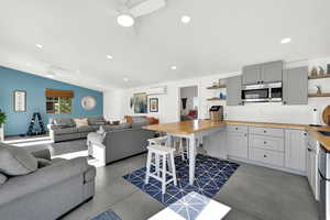 All concrete floors for no worry access from pool.  Kitchen area with bar