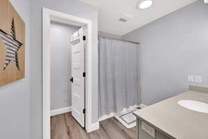 Upstairs bathroom with large vanity and separate toilet room