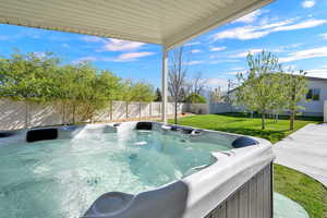Covered hot tub area and side yard