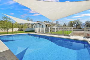 Beautiful in ground pool, heated, salt water with retractable liner and shades that are removeable