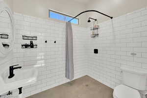Walk in shower in the pool house with concrete floor for easy access from pool