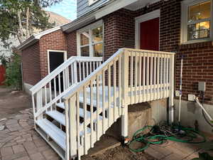 View of exterior entry with brick siding and a mountain view