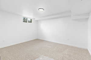 Below grade area with carpet and baseboards