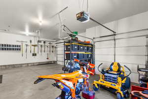 Garage featuring a garage door opener