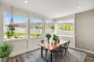 Dining area featuring a mountain view, recessed lighting, and dark wood-style flooring