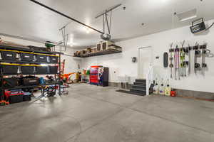 Garage featuring a sink and a garage door opener