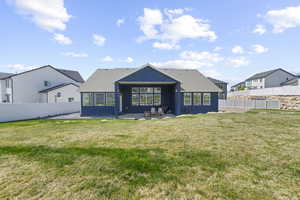 Rear view of house featuring a patio, a fenced backyard, stucco siding, and a shingled roof