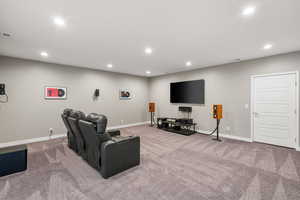 Living room featuring recessed lighting and light colored carpet