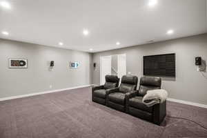 Carpeted cinema featuring recessed lighting and baseboards