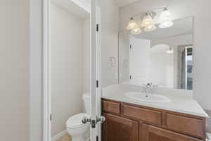 Bathroom with toilet and vanity