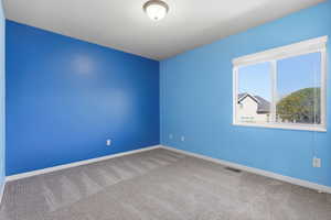 Spare room with carpet flooring and baseboards