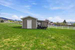 View of shed with a mountain view and a view of countryside