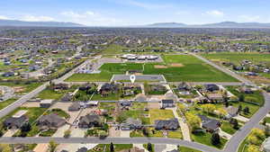 View of property location featuring nearby suburban area and a mountain backdrop